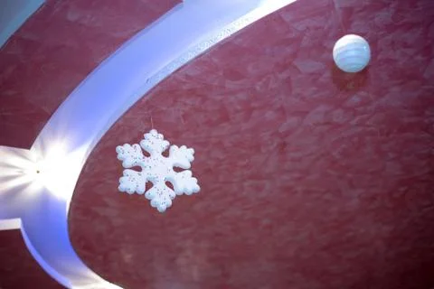 One snowflake which hangs in the restaurant. Winter snowflakes background. Stock Photos