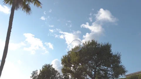 One Soap bubble splash at the park, Eur. Rome, Italy. Slow motion. Video stock 125057548