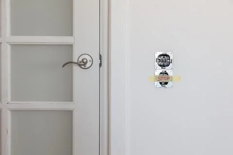 One socket and switcher of the lights installed in the white wall Stock Photos