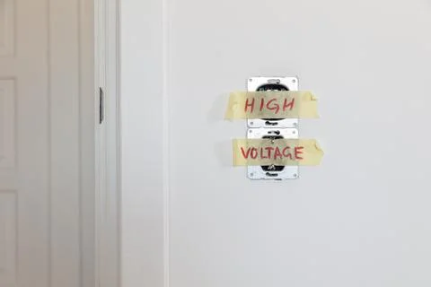 One socket and switcher of the lights installed in the white wall Stock Photos