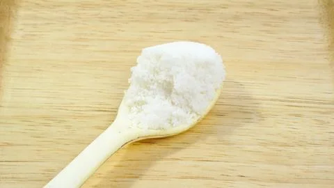 One Spoon of Salt on White Background Stock Photos