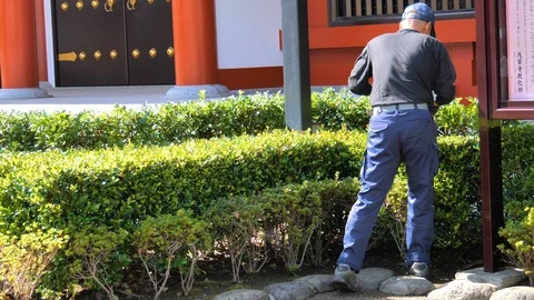 One of the staff inside the Senso-ji Temple in Tokyo Japan Stock Footage 121383483