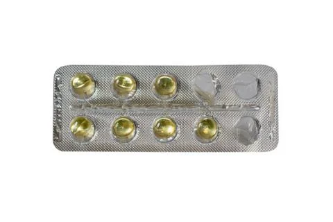 One started foil package with pills isolated on white background Stock Photos