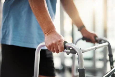 One step at a time. Closeup shot of a senior man using a walker. Stock Photos