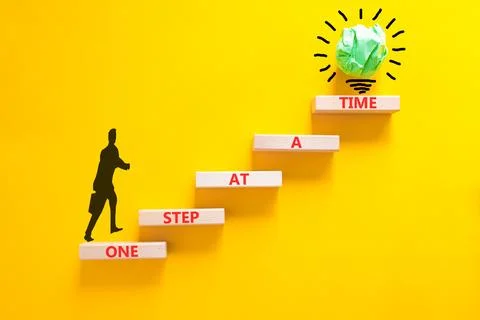 One step at a time symbol. Concept words One step at a time on beautiful wo.. 写真素材