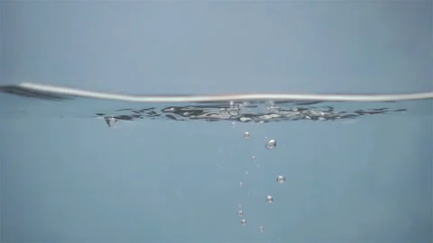 One strawberry falling into water in slow motion Stock Footage 152607613
