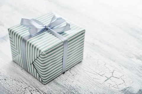 One striped  gift box with grey ribbon Stock Photos