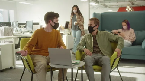 One of the students meets his classmate and they start discussing their project Stock Footage 175427108