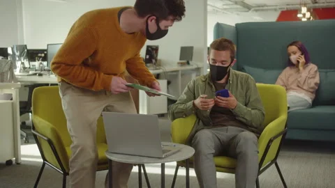 One of the students meets his classmate and they start discussing their project Stock Footage 175428116