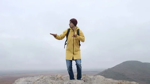 One stylish guy moving in freestyle on rock hill with stones. Expressing of ente Stock Footage 199493128