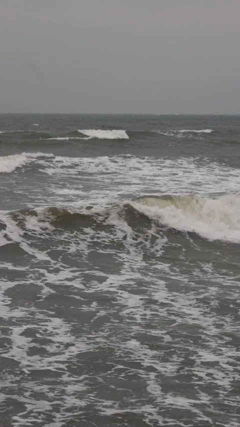 One surfer riding storm ocean waves. Surfer falling from board. Stock Footage 329622905
