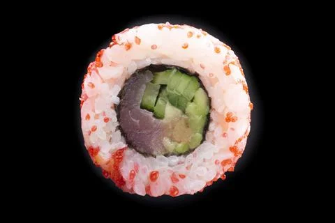 One sushi roll close up on black background Stock Photos