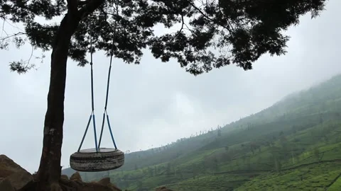 One swing atop a hill that moves without people Stock-Footage 146451721