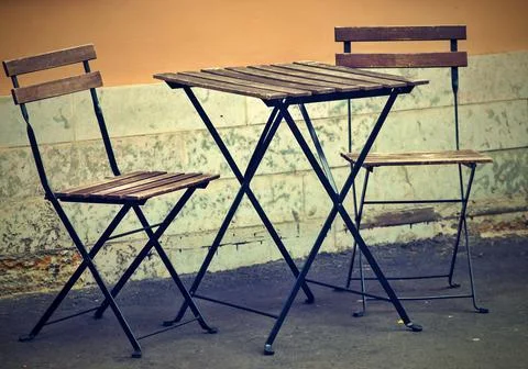 One table and two chairs on the street Stock Photos
