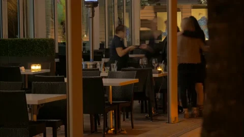 One Table of Ladies at Oceans 234 During Pandemic Night Time Lapse Stock Footage 169748879
