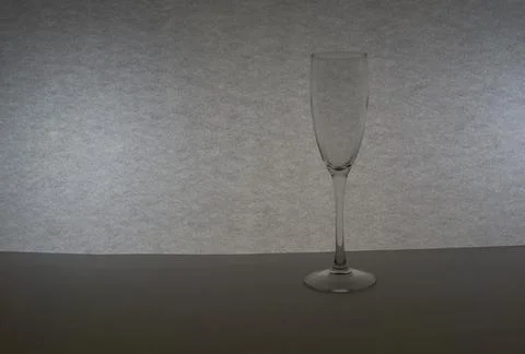 One tall empty champagne glass Stock Photos
