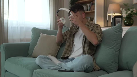 One teen man doing guided meditation yoga self care practice at home Stock Footage 251069121