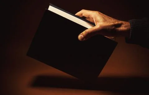 One Thick Book in a Hand Foto stock