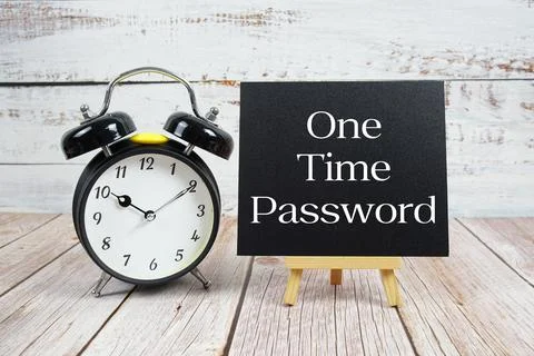 One Time Password text with easel and alarm clock on wooden background Fotos de archivo