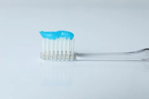 One toothbrush with toothpaste on white background, closeup Stock Photos
