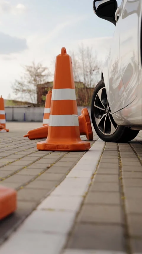 One of the traffic cones is knocked down during the practical driving test Stock Footage 275011994