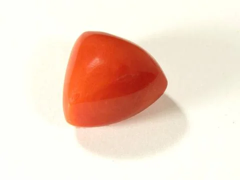 One triangle shape of coral munga gems according to astrology represents m... Stock Photos