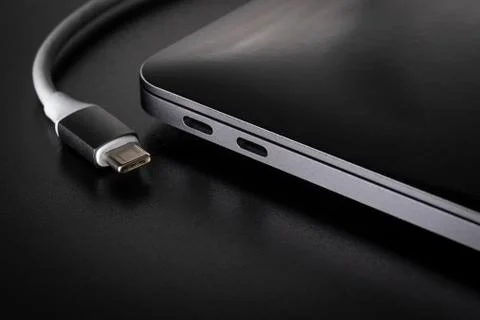 One USB type C cable disconnected from laptop Foto stock