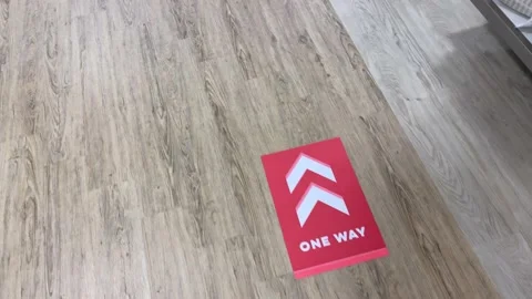 One Way Arrows on Floor of Store - Social Distance Stock Footage 138963194