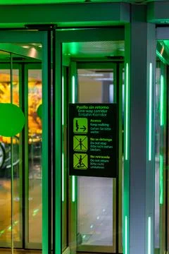 One way corridor automatic door that is green lit Stock Photos