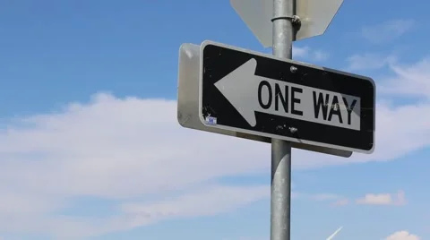 One Way Road Sign in Blue Sky and White Clouds Stock Footage 54801351