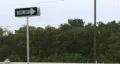 One Way Sign On Highway Road BY Trees HD Footage