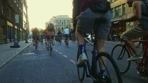 One wheel on a bicycle. Group of cyclists in Shoreditch London. 스톡 동영상 196015614