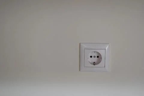 One white electric socket with earthing and deepening of the plug Stock Photos