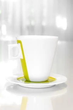 One white mug on a white table Stock Photos