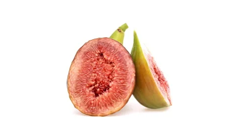 One whole and two fig fruit halves rotating. Isolated on white background. Stock Footage 160147798