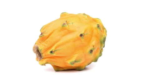 One whole yellow dragon fruit is rotating on white background. Stock Footage 158917052