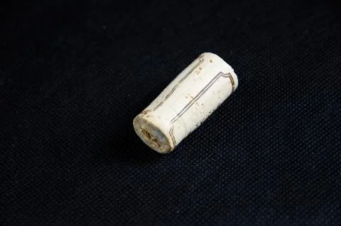One wine cork at black surface Stock Photos
