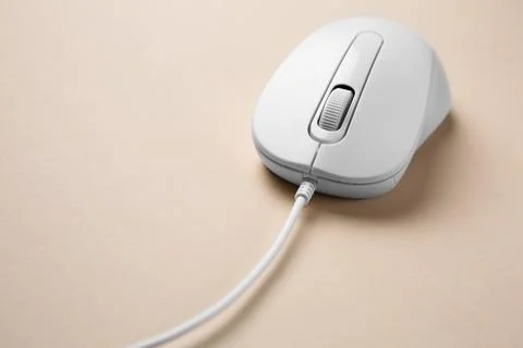 One wired mouse on beige background, closeup Foto stock