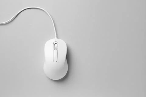 One wired mouse on grey background, top view. Space for text Foto stock