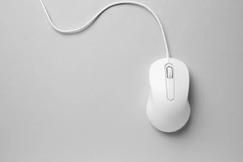 One wired mouse on grey background, top view. Space for text Foto stock