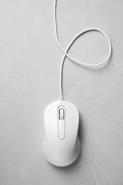 One wired mouse on grey textured table, top view Stock Photos