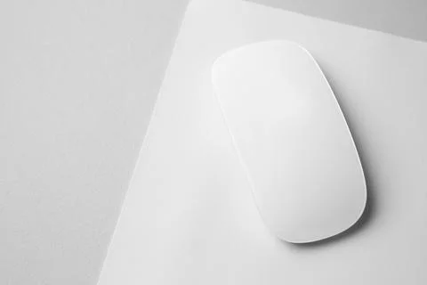 One wireless mouse with mousepad on grey background, above view. Space for te Stock Photos