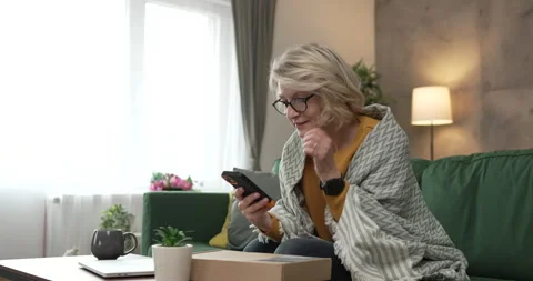 One woman checking box of received package or product at home Stock Footage 270336390