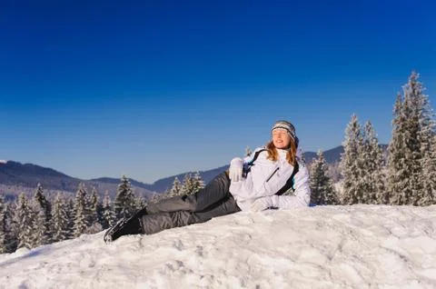 One woman lies on snow Stock Photos
