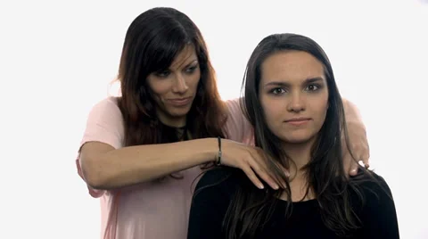 One women trying to strangle another on white background Stock Footage 39444512