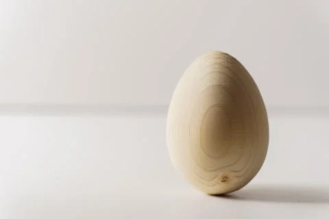 One wooden egg on white background Stock Photos