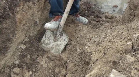 One Worker Digs A Trench Stock Footage 58030582