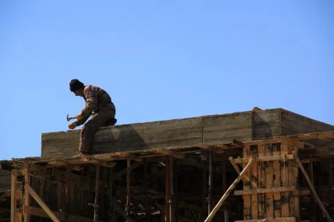One worker working on construction of building Stock Photos