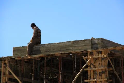 One worker working on construction of building Stock Photos