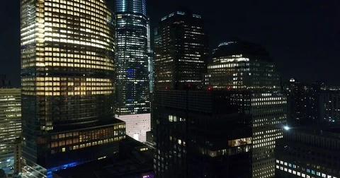 One World Trade Center glowing at night layered overhead aerial view in NYC Vídeo Stock 76969085